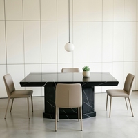 Table à manger géométrique moderne avant-gardiste à base lourde en marbre Nero Marquina pour salles à manger de villas de luxe et espaces artistiques de créateurs
