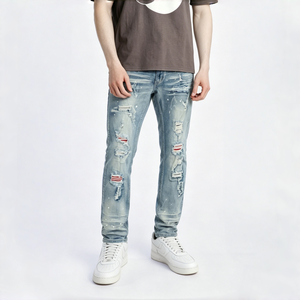 Prendas de mezclilla vintage rebeldes y desgastadas con adornos rasgados, deshilachados y con parches para una estética urbana de hip-hop y punk. - Product Image 1
