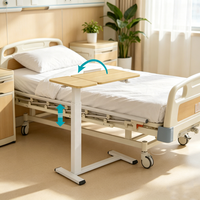 Table de lit roulante pneumatique en métal pour mobilier hospitalier avec plateau inclinable, design moderne pour usage patientiel dans les écoles et les chambres