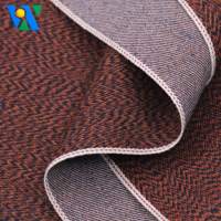 Tela vaquera selvedge de 10.6oz, ligera, con textura especial de espiga ondulada, color naranja gris, tejido de sarga teñido con hilo para jeans.