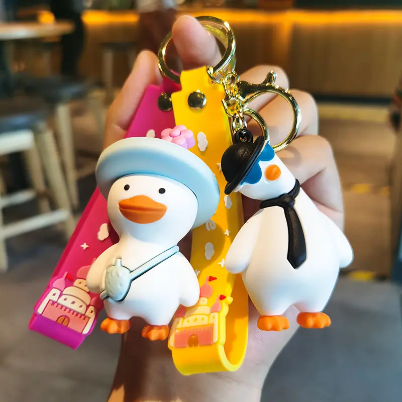 Wholesale cartoon cute funny duck soft rubber pvc keychain girl schoolbag pendant crystal key chains