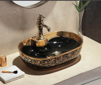 Nouveau modèle de bassin de style Céramique Placage doré Salle de bain Évier couleur or noir