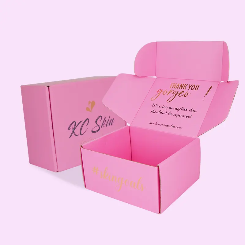 Kertas karton warna-warni ramah lingkungan pakaian kosmetik kotak Logo kustom dicetak kotak kemasan pengiriman merah muda bergelombang