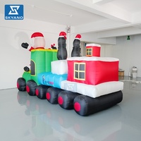 Grandes décorations de Noël gonflables : Père Noël et train pour affichage publicitaire de festival