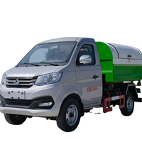 Camion à ordures élévateur à crochet compact Changan 4 CBM bras hydraulique système de décollage collecteur d'ordures automatique 4x2 manuel Euro 4 émissions