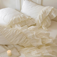 Ensemble quatre pièces en coton lavé de style crème français avec dentelle, housse de couette en forme de feuille de lotus, style princesse, qualité automne, rembourrage en laine