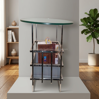 Table basse ovale en verre avec structure en métal et étagère de rangement, design moderne pour salon