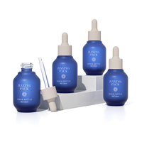 Bouteille de récipient en verre de 30ml 1oz avec pompe personnalisé écologique givré bleu cosmétique pour les poils du visage brume spray lotion sérum