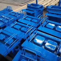 Machine motorisée manuelle pour la fabrication de blocs creux, moule pour mur de soutènement en béton pour la production de briques en ciment, axée sur la matière première