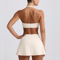 Ensemble de soutien-gorge de sport respirant et antichoc, short en tissu brossé haute élasticité, col halter, motif uni, tenue de yoga et de tennis pour femmes