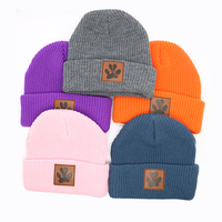 Patch en cuir personnalisé Logo hiver chaud 100% acrylique matériel gros Sports de plein air crâne unisexe laine bonnet tricoté bonnet chapeaux