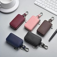 Porte-clés de voiture tendance en gros, étui souple en PU et cuir véritable avec fermeture éclair pour homme et femme, mini portefeuille pour clés
