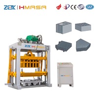 Machine automatique de fabrication de blocs de béton QTJ4-40 avec système de moules modulaires pour briques autobloquantes