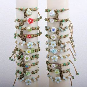 Bracelets rustiques faits main en corde cirée, style bohème, avec breloques florales en céramique (fleurs et feuilles) - Product Image 1