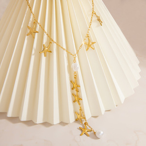 Collier de perles à motif étoile, couleur or 18 carats, chaîne de clavicule, pour femme, à porter au quotidien, thème océan, design géométrique - Product Image 1