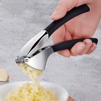 Outil manuel de purée de gingembre de presse d'ail de style populaire utilisé pour presser la purée d'ail