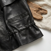 Veste en cuir de mouton noir vintage pour femme, col montant, patte de boutonnage asymétrique, veste courte en véritable peau de mouton avec poches