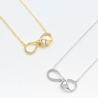 Sofistication intemporelle, collier d'amour Mobius en argent sterling 925, chaîne de clavicule, pendentif cœur infini rotatif artisanal romantique