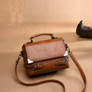 Distressed <b>Handbag</b>. <b>Vintage</b>-look brown bag with double buckle straps. Available at wholesale prices - Product Image 1