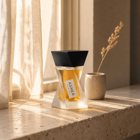 Flacon de parfum vide de luxe noir brillant torsadé géométrique sculptural à facettes avec base en verre lourd, lettrage doré, logo personnalisé