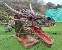 Statue réaliste de tête de dragon de machine de tour de dragons avec des mouvements adaptés aux besoins du client