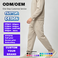 Pantalon de jogging fuselé beige pour homme avec revers côtelés, poche plaquée pentagonale, taille élastique avec cordon de serrage, poche oblique et fausse braguette, style décontracté