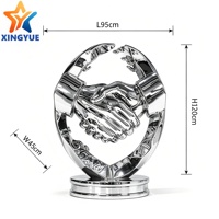 Sculpture de poignée de main en acier inoxydable poli miroir sur mesure, statue métallique pour partenariat gagnant-gagnant, idéale pour hall d'hôtel et entrée d'entreprise