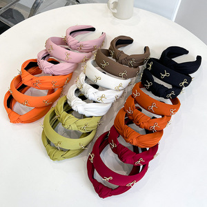 Vente en gros de bandeaux pour femmes de style européen et américain, couleur unie, en éponge, avec nœud en <span class=keywords><strong>métal</strong></span> doré - Product Image 6