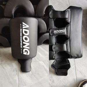 AIDONG - Protectores de Piernas para Karate y Boxeo, Equipo de Protección para Artes Marciales, Equipo de MMA, Protectores de Pantorrillas Resistentes para Patadas, Protectores de Patadas de Muay Thai - Product Image 1