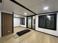 Villa modulaire préfabriquée avec entrée LED, studio moderne gris anthracite pour bureau à domicile dans la cour