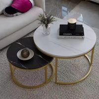 Table d'appoint ronde en métal noir et or avec plateau en verre, céramique ou marbre texturé pour salon