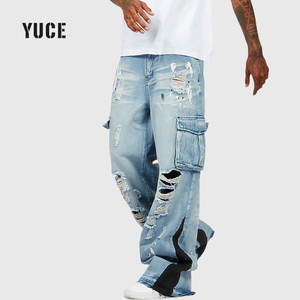 بنطلون جينز كارجو للرجال بلون أزرق فاتح، ممزق ومتعدد الجيوب، بتصميم واسع الساق ومرقع، مع تأثيرات الطلاء، مناسب لأزياء الشارع - Product Image 2