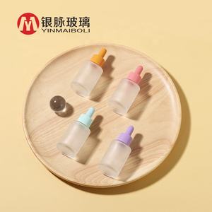 ขวดแก้วหยดขนาด 30 มล. พร้อมปิเปต ขวดแก้วทรงหัวกะโหลกสำหรับน้ำมันหอมระเหยขนาด 30 มล. 50 มล. พร้อมหลอดหยดสีชมพู - Product Image 1