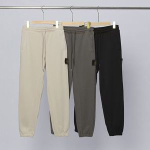 Nuevo estilo de pantalones casuales a la moda, pantalones deportivos Compass hasta el tobillo, pantalones deportivos versátiles, pantalones largos STONE para hombre y mujer - Product Image 1