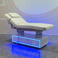 Lit de beauté électrique moderne en acier inoxydable fabriqué en usine avec un design unique pour salon, spa, table de massage