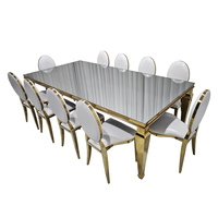 Ensemble de table à manger rectangulaire avec plateau en verre miroir et base en acier inoxydable doré
