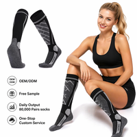 Chaussettes de ski personnalisées en laine mérinos, épaisses, hautes jusqu'au genou, à compression, avec semelle rembourrée, motif uni, vente en gros OEM