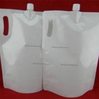 Machine de remplissage et de bouchage semi-automatique pour sachets à bec verseur de boissons, miel, liquides et détergents