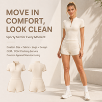 Ensemble deux pièces sportif beige pour femme avec bordure contrastante et demi-fermeture éclair, coupe ajustée personnalisée, tenue athlétique décontractée, vente en gros