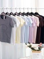 Été Nouveau 2.0 Yoga de course pour les dames Séchage rapide à manches courtes Col sans couture Anti-boulochage Base Show Waist Hip Women's T-Shirts