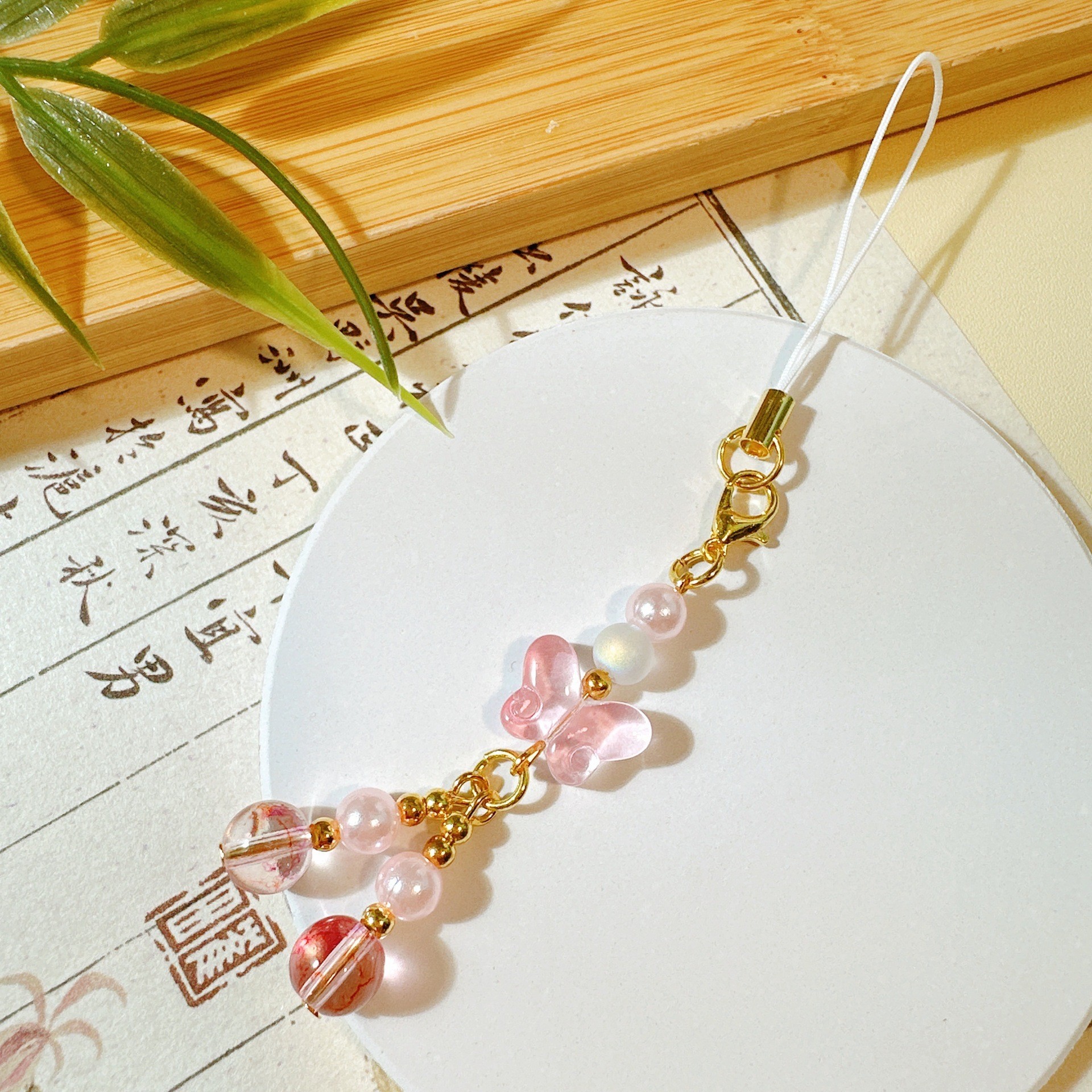 25a48 petit papillon émaillé rose