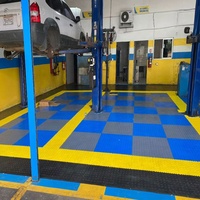 Carreau de sol de garage à emboîtement en PVC d'atelier antidérapant modulaire rigide pour parking de voiture Carreaux de sol de garage Revêtement de sol en caoutchouc