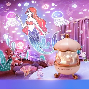 Luz de noche LED romántica con casa rotativa Proyección de cielo estrellado Mini altavoz inalámbrico Cosmic Dream para niños y adultos - Product Image 1