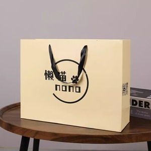 Sacs cadeaux écologiques de luxe imperméables beiges personnalisés avec ruban et logo imprimé, 100 pièces, petits sacs en carton pour bougies - Product Image 3