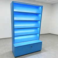 Étagère de présentation moderne avec rétroéclairage LED bleu, vitrine multi-niveaux avec base verrouillable pour produits de tabac/produits pharmaceutiques
