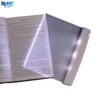 Lampe de lecture à LED avec corps bleu et blanc, pince flexible pour une utilisation en intérieur dans le salon