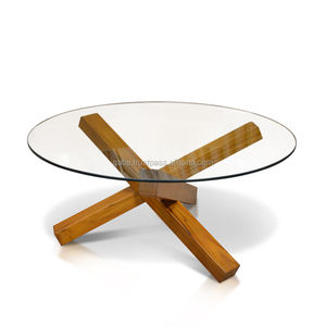 Elegante mesa de centro redonda con patas cruzadas de madera de teca maciza y una elegante superficie de vidrio, que combina durabilidad con un diseño moderno. - Product Image 3