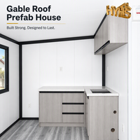 Maison conteneur ondulée à cadre noir de 20 pieds, 2 chambres, salle de bain complète, fenêtres coulissantes extensibles à double aile, moderne, ISO 9001 CE