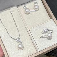 Ensemble de bijoux tendance pour femme en argent plaqué platine avec étoile, comprenant un collier, des boucles d'oreilles et une bague, orné de perles d'eau douce naturelles blanches de 7 à 10 mm