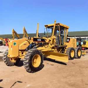Motoniveladora CAT140K CAT140 de 14T, Fabricada en Japón, 128KW, Pocas Horas, Disponible en Stock, Excelente Estado, Bomba Caterpillar de Segunda Mano - Product Image 1